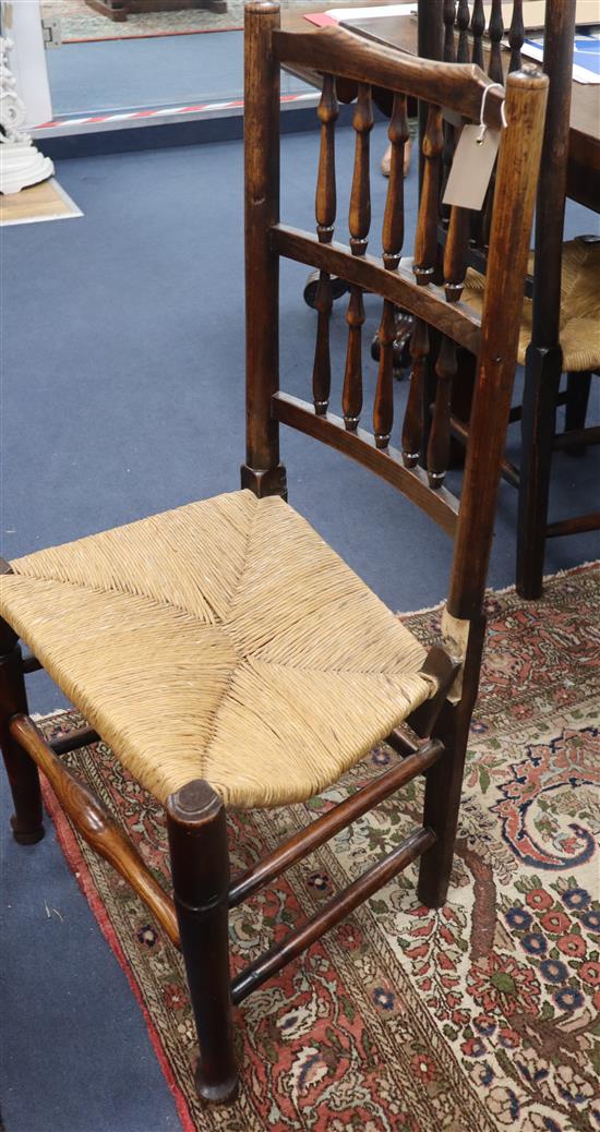 A set of eight Lancashire ash and beech rush seated spindle back dining chairs (two with arms)